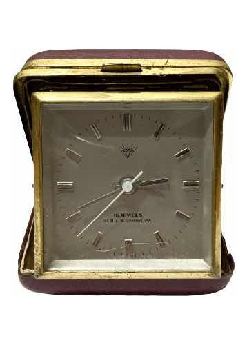 Vintage Shanghai China clock with 15 jewels, gold-tone frame, and classic square face in protective case