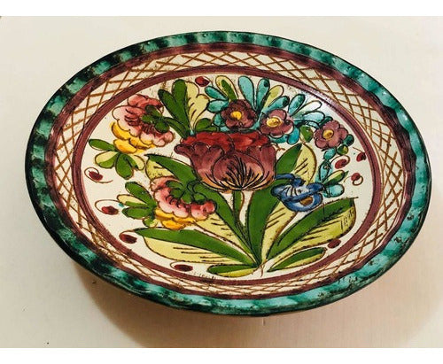 Vintage porcelain plate with colorful hand-painted floral rose design and green decorative border