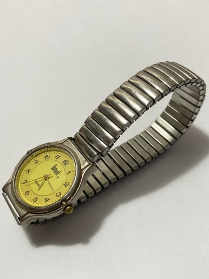 Relógio Antigo Dumont Quartz Pulseira Elastica Prata Dourado Prateado