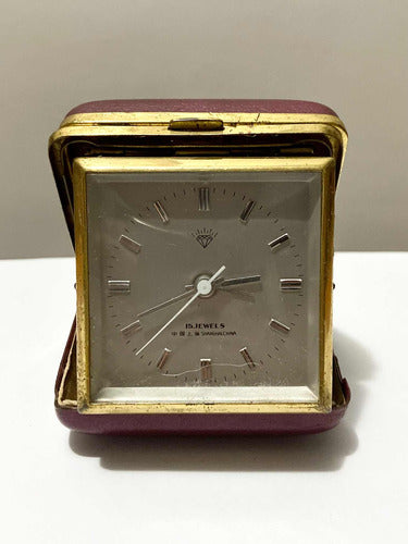 Vintage Shanghai China 15 Jewels travel clock with gold trim and folding protective case in burgundy color