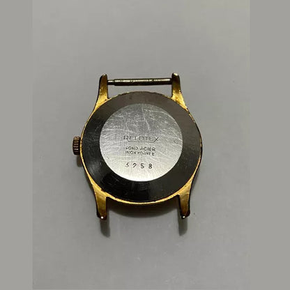 Back case of a vintage Relotex Ancre watch with 17 rubies, stainless steel and gold-tone details in used condition.