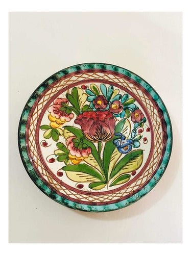 Vintage porcelain plate with colorful hand-painted pink rose and floral design on white background